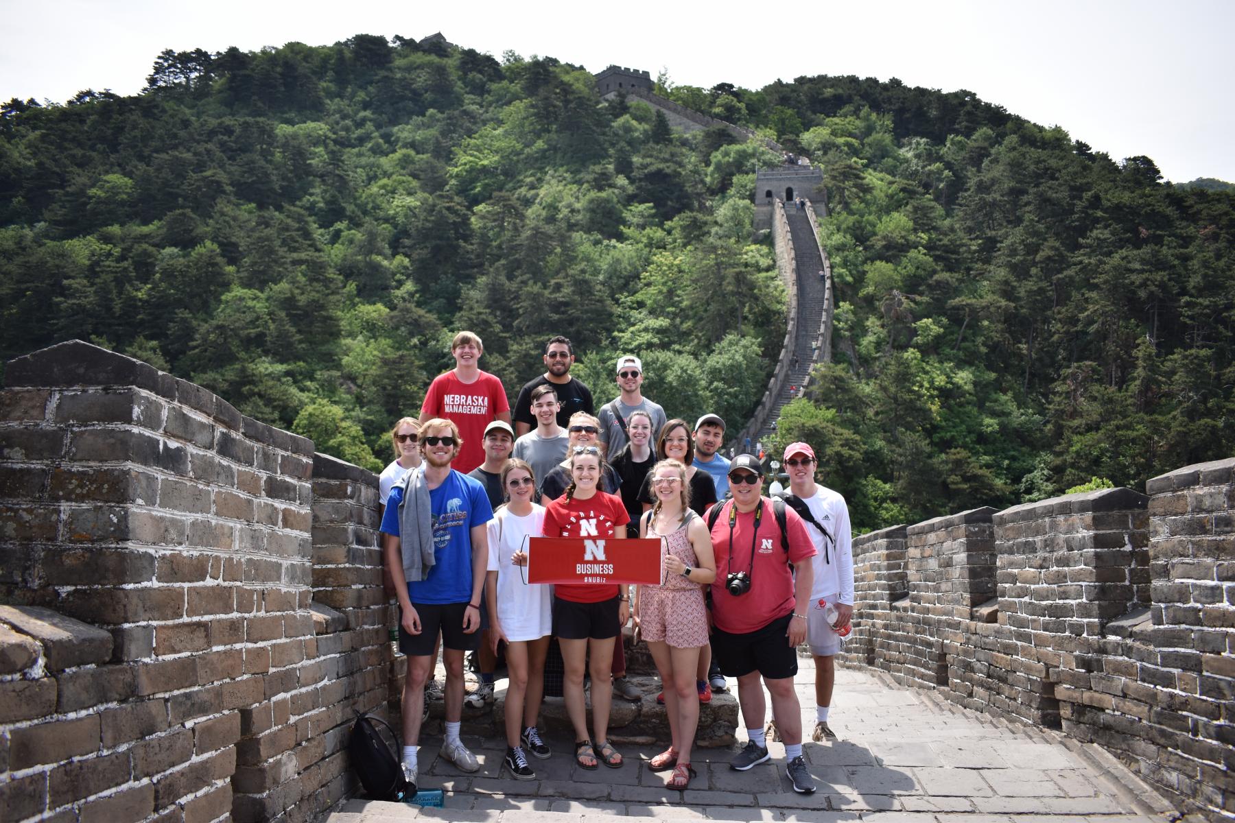 Students smiling at the Great Wall of China.